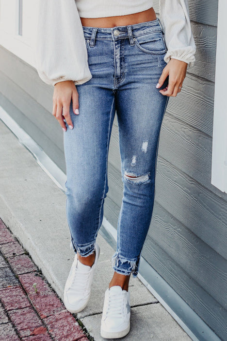 Light blue distressed frayed jeans